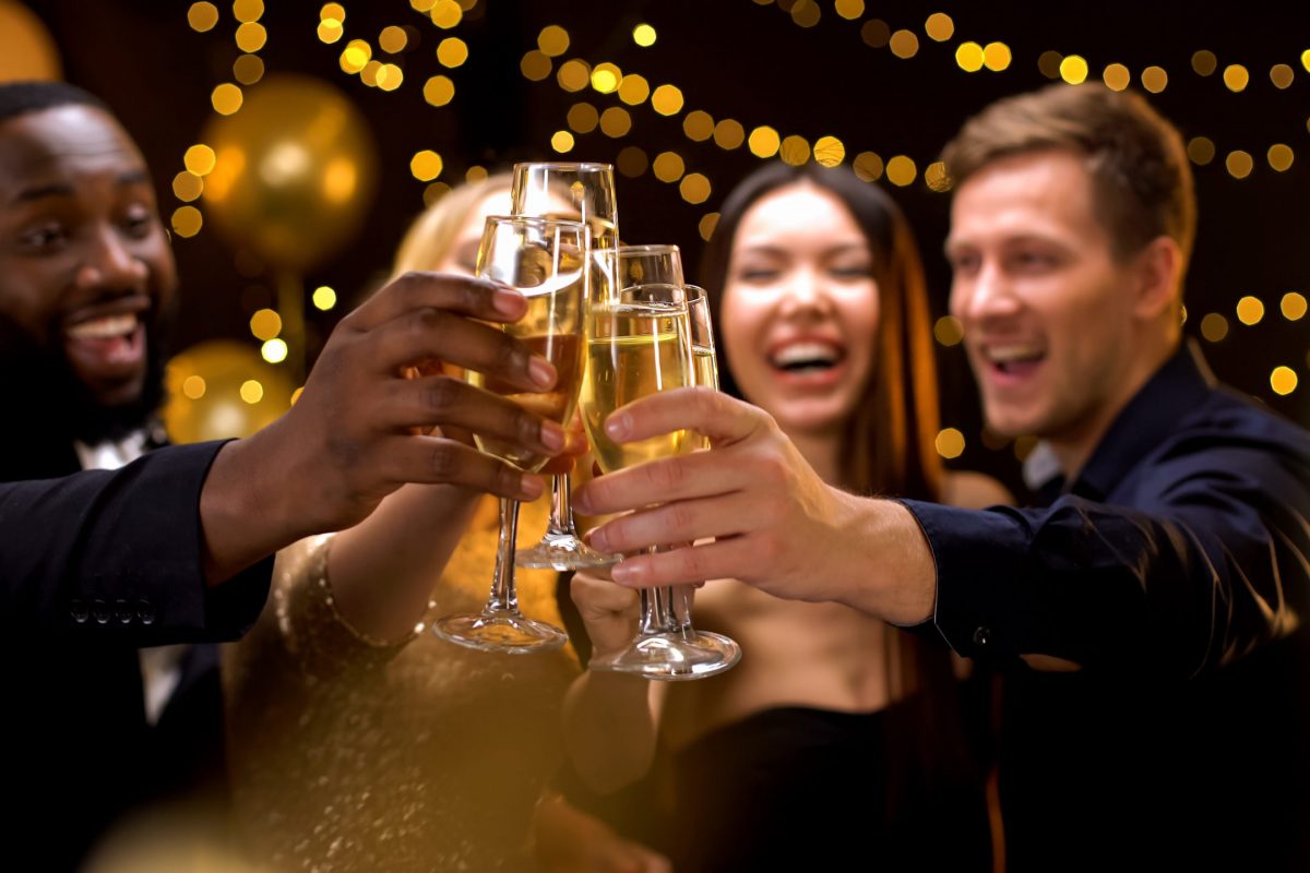 Cheerful multi-racial friends clinking champagne glasses, corporate event, fun